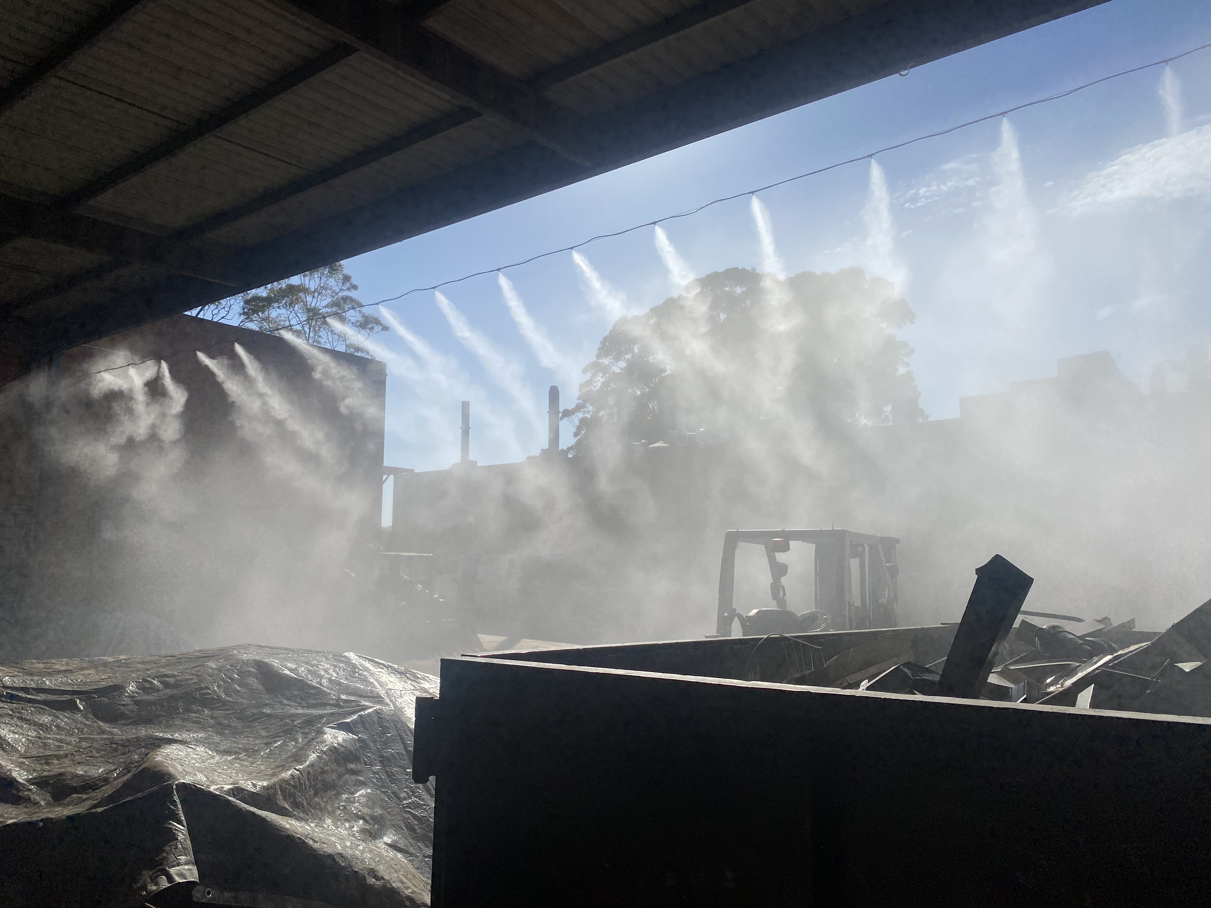 Catenary misting lines over industrial yard