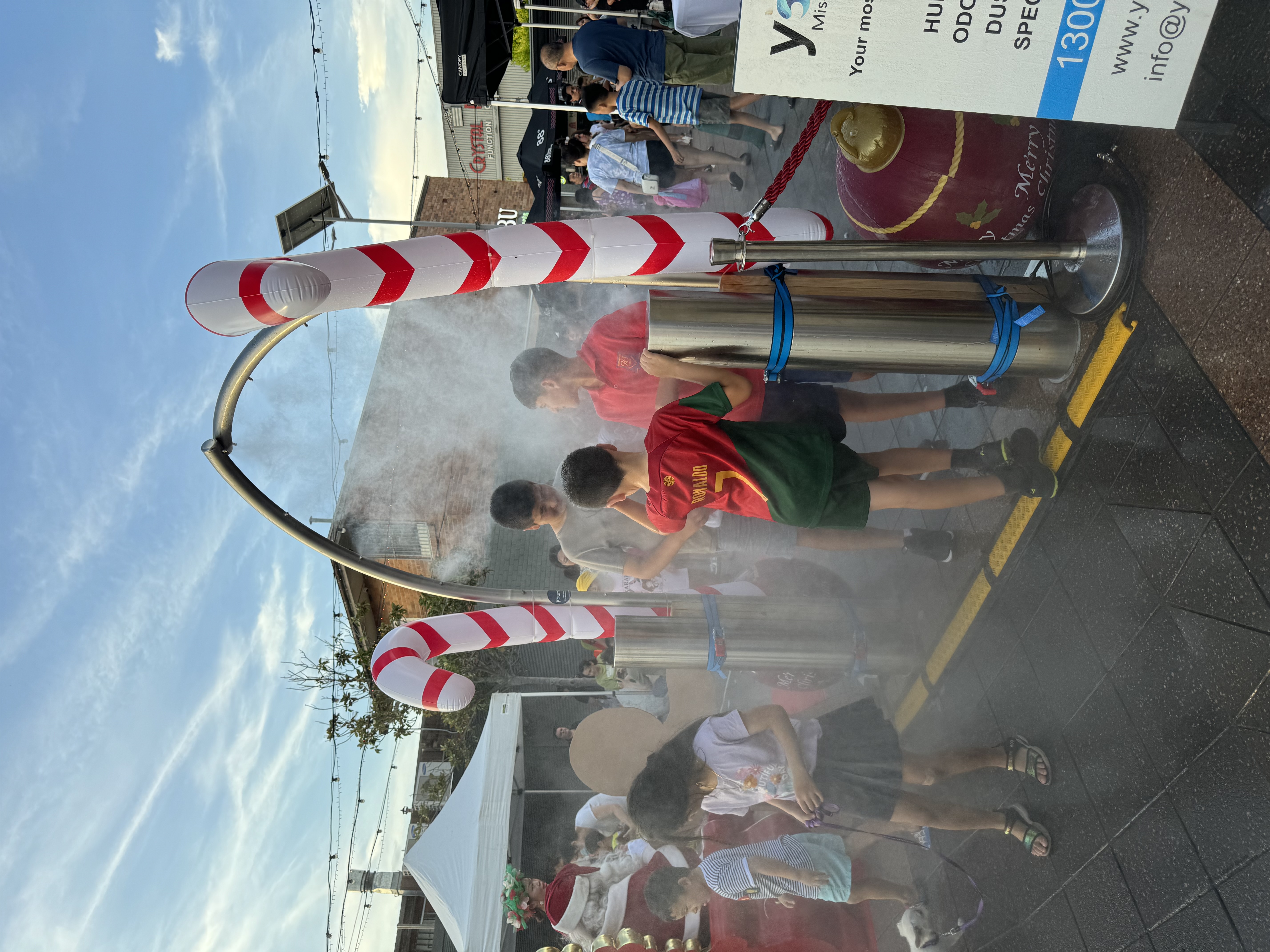 Cooling station at outdoor event with crowd