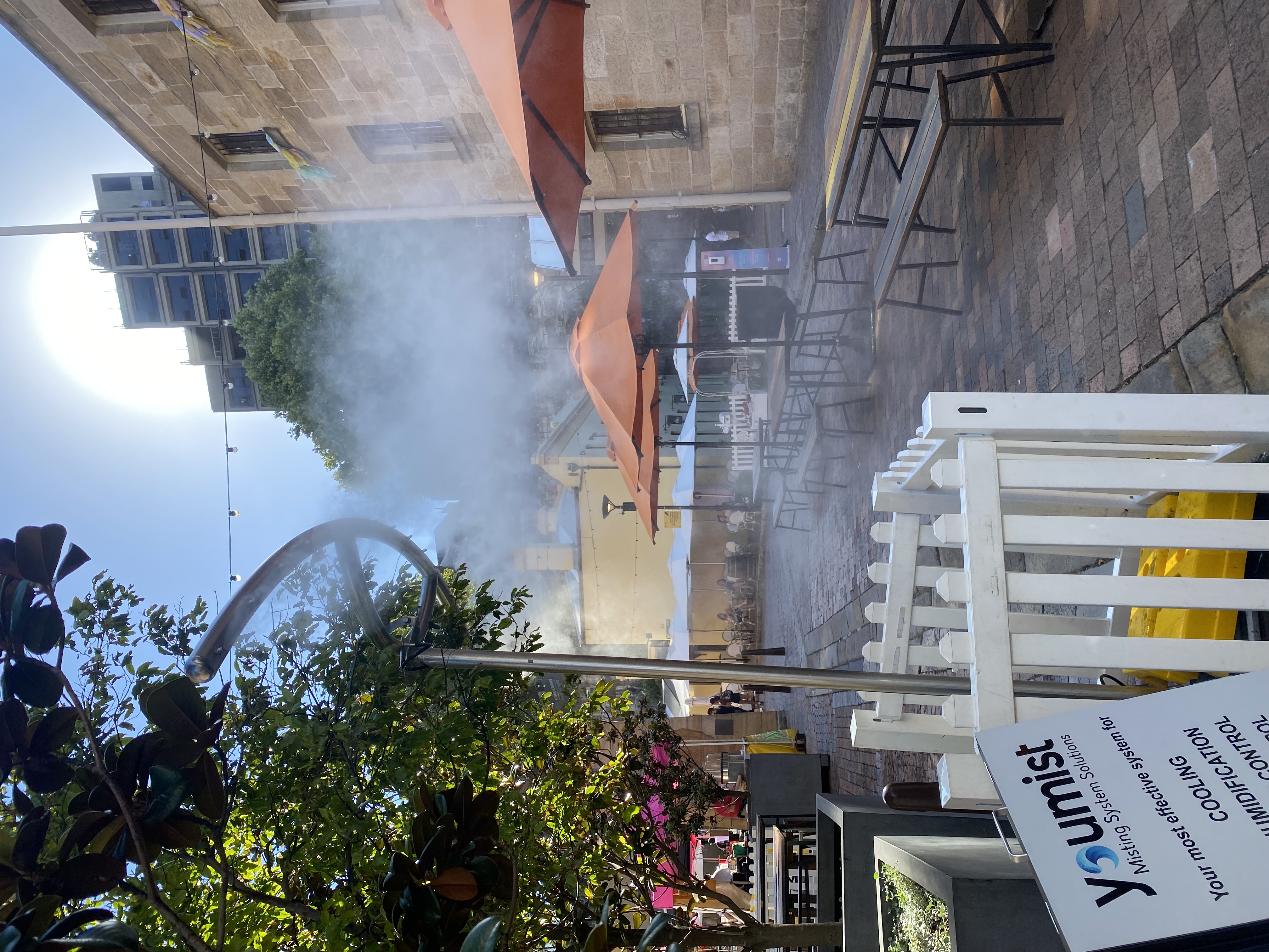 Cooling station misting in outdoor dining area