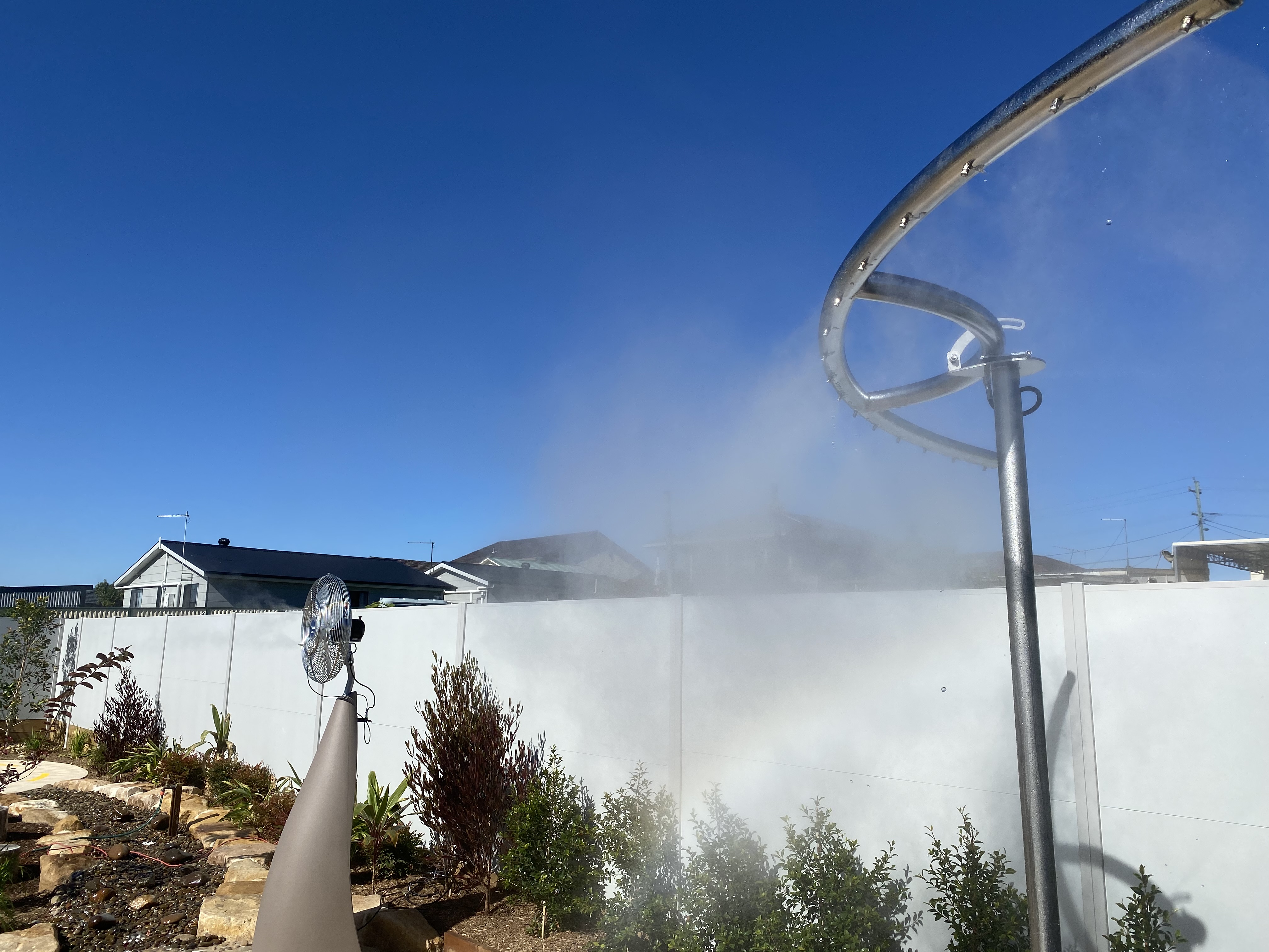 Cooling station misting at residential installation