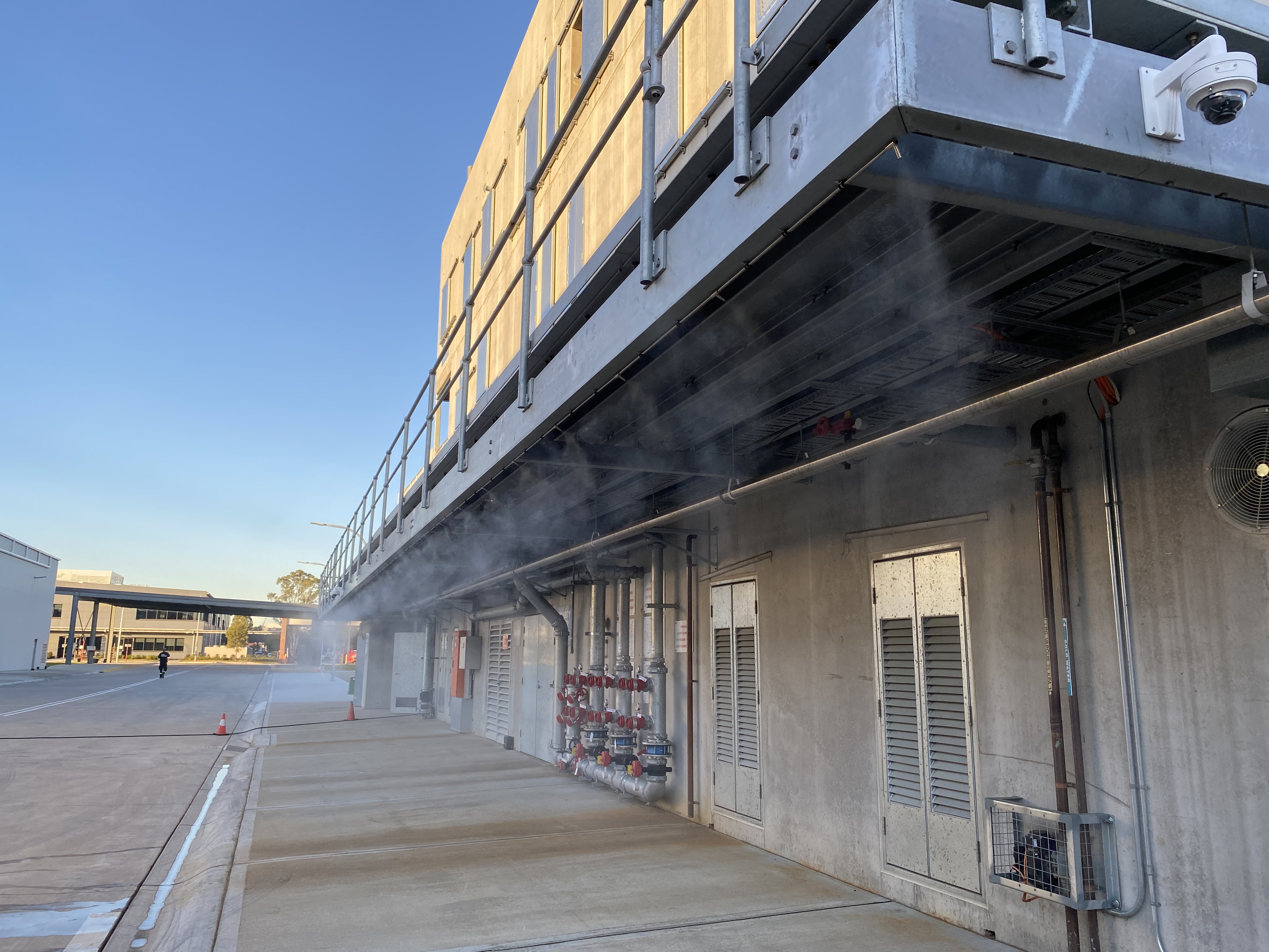 Fixed perimeter misting lines at commercial facility