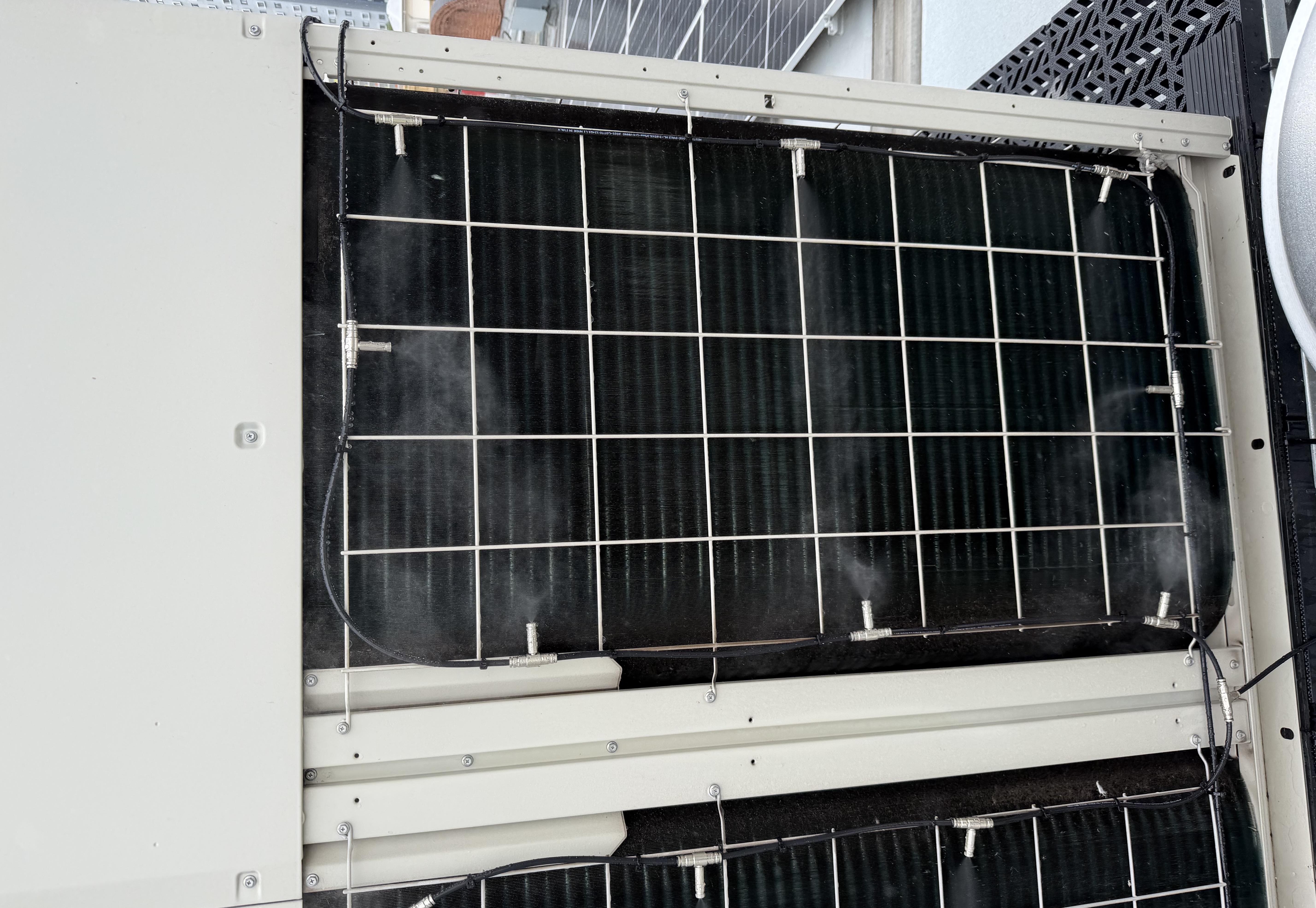 HVAC condenser pre-cooling misting system