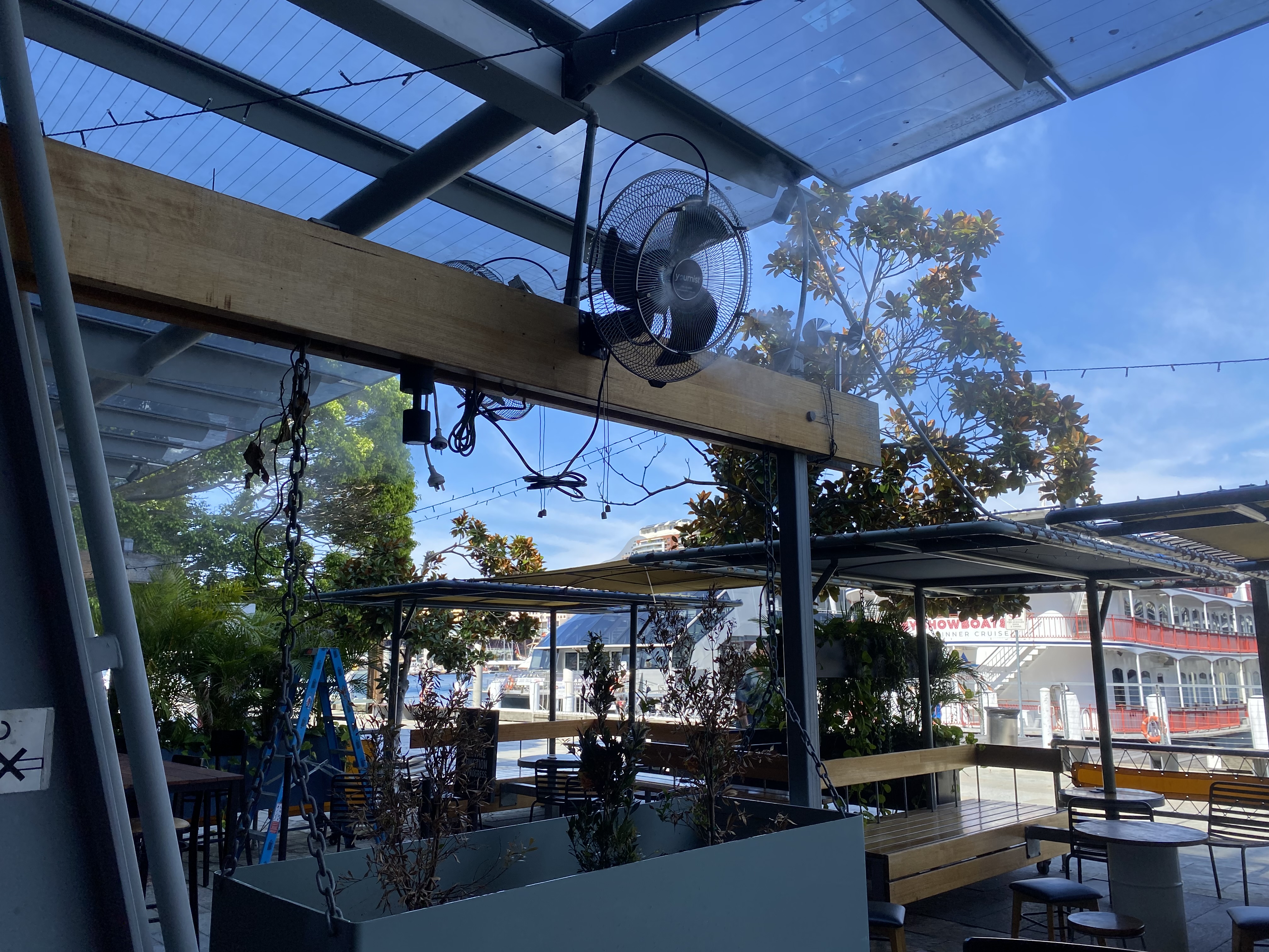 Misting fan in industrial facility